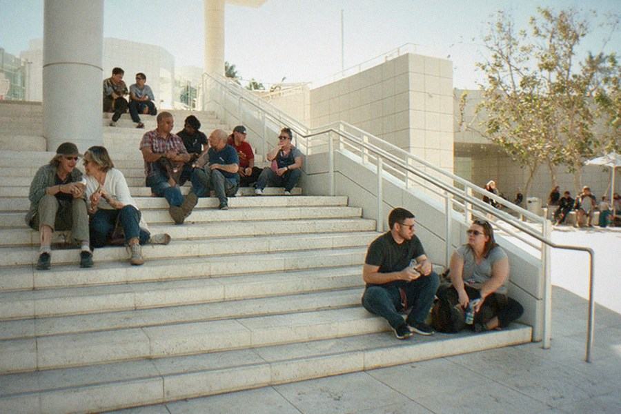 A columned courtyard garden with a reflecting pool surrounded by museum buildings
