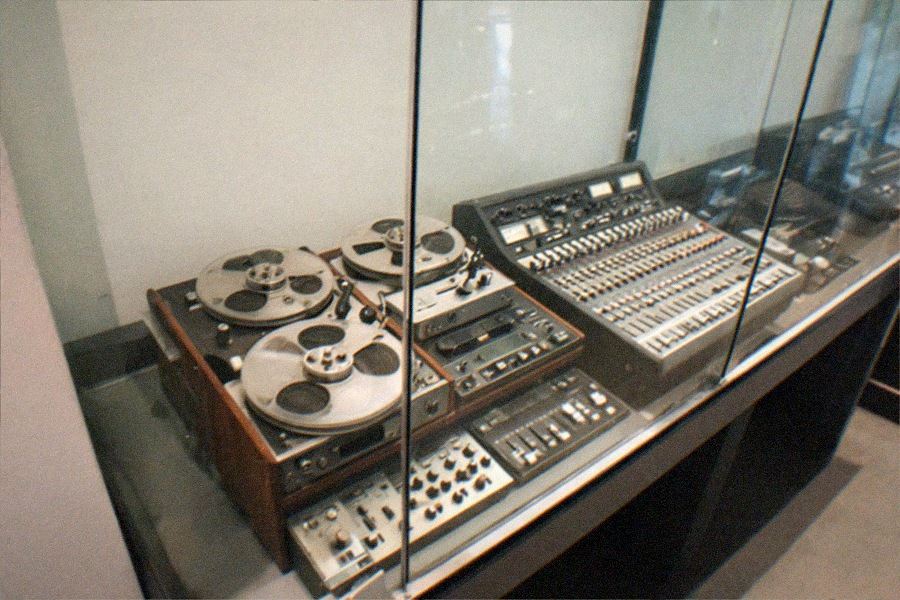 An interactive music exhibit gallery at the GRAMMY Museum, with listening stations and touchscreens along the walls