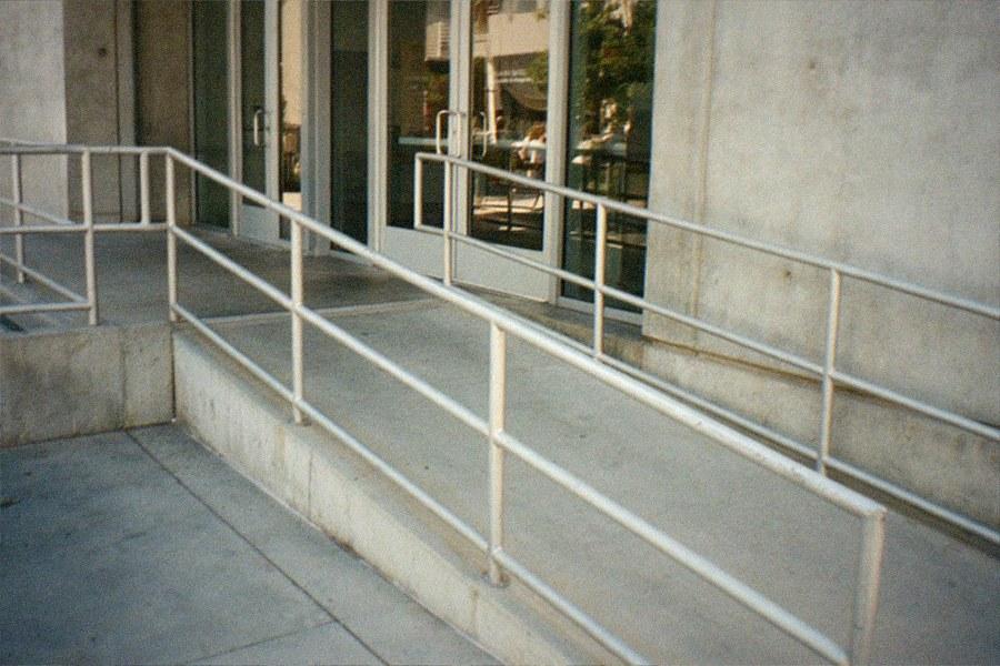 Museum parking structure entrance with cars lining up at the gate
